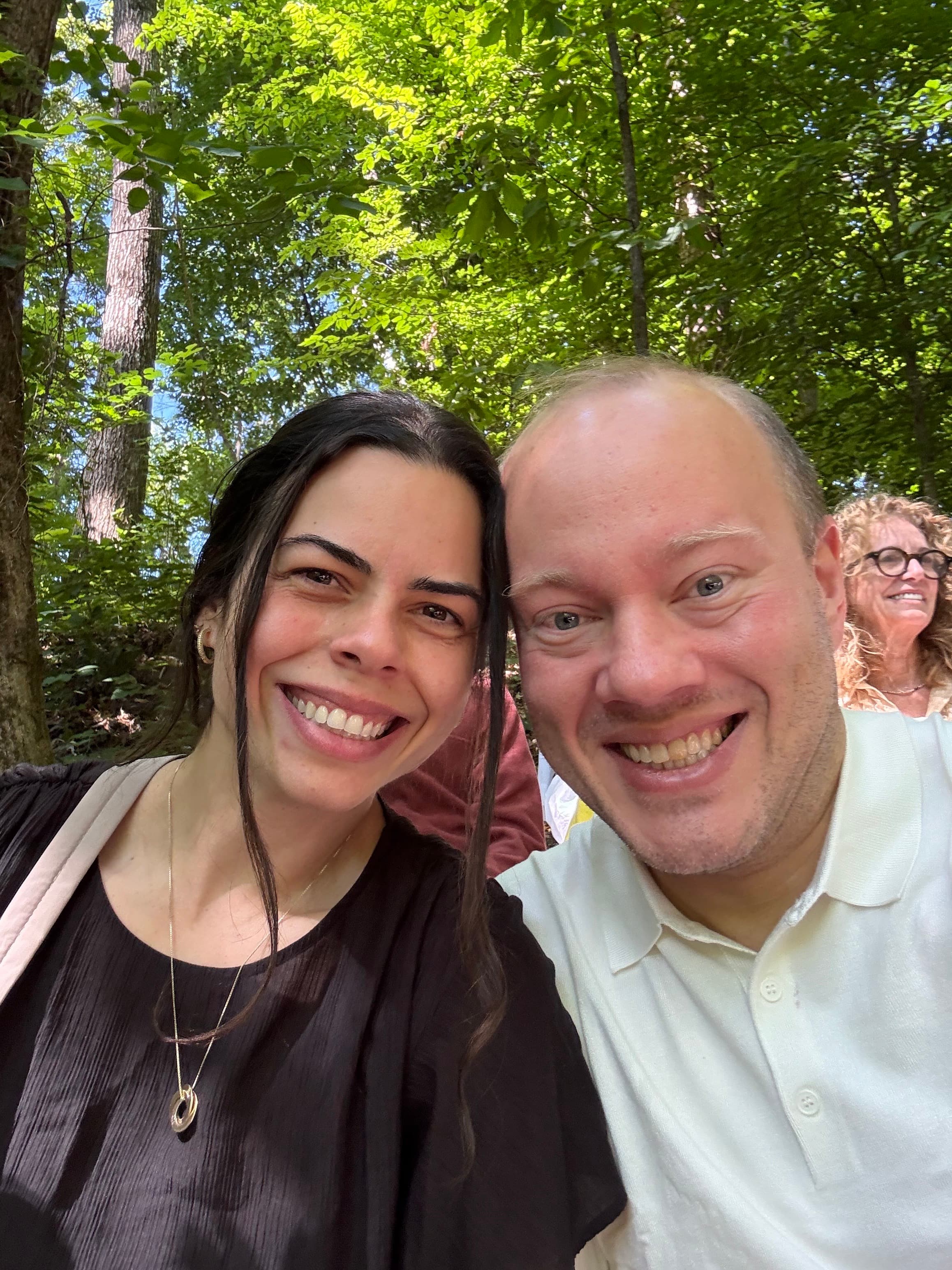 Rodrigo and Vanessa smiling together outdoors