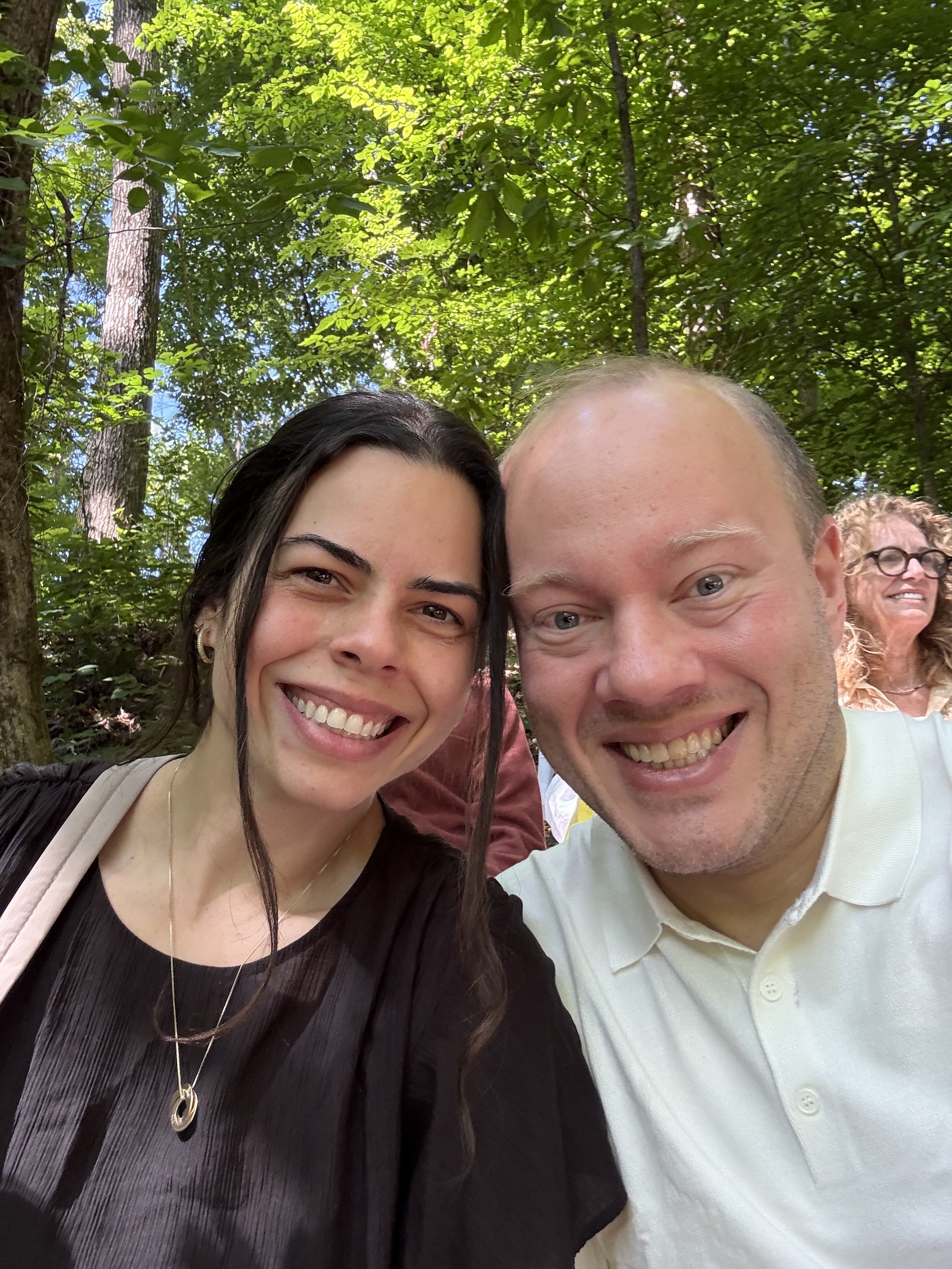 Rodrigo and Vanessa smiling together outdoors